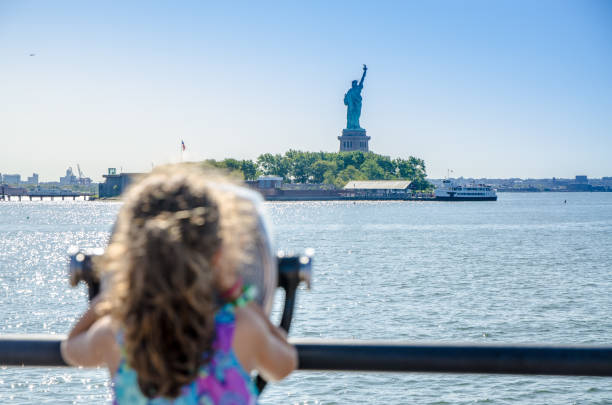 istock Kid looking at Statue of Liberty 1170418656