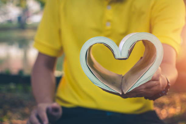istock Men read books in quiet nature, Concept read a books. 1170425393