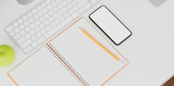 istock Top view of minimal workplace with blank screen smartphone 1170425479