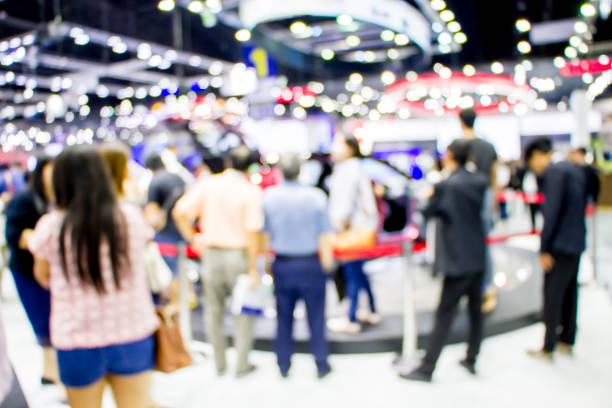 istock blurred people in motor show 1170426609