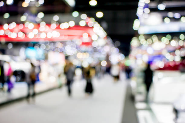 istock blurred people in motor show 1170426616