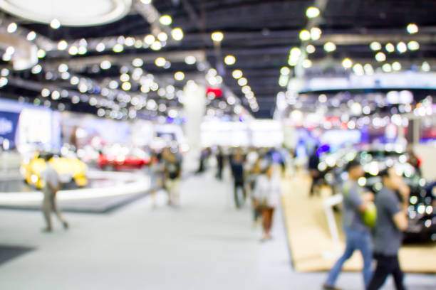 istock blurred people in motor show 1170426783