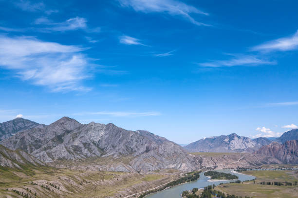 istock Aerial landscape with mountains and river under blue sky in summer 1170427487