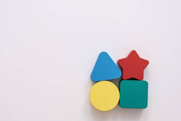 istock On a white background in a chaotic manner are large multi-colored children's figures. copy space 1170429781