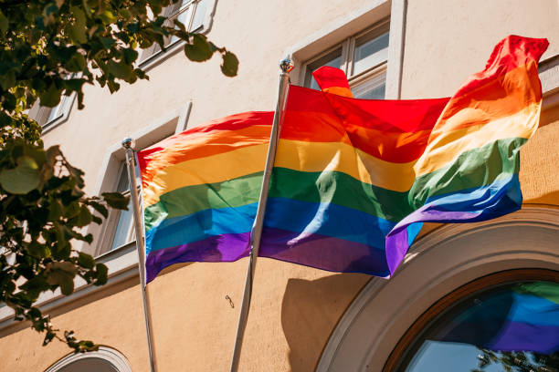 istock LGBT flag over the building 1170432955