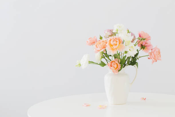 istock beautiful roses in ceramic white jug 1170439492