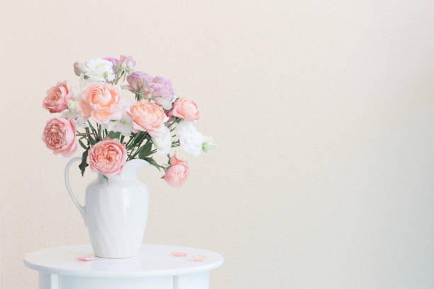 istock beautiful roses in ceramic white jug 1170439502