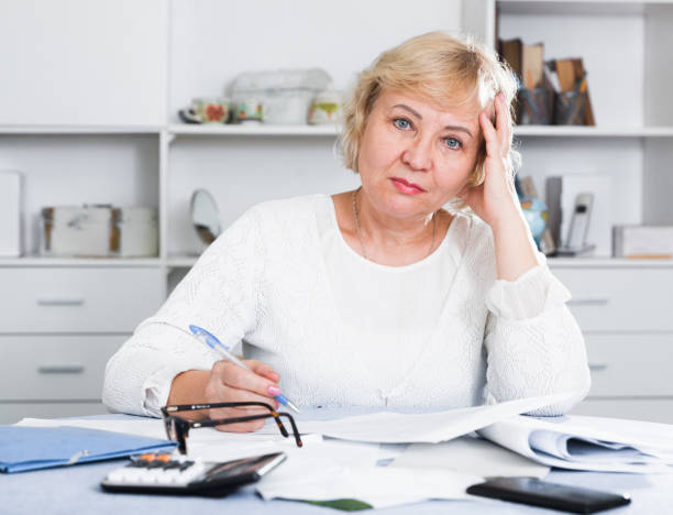 istock Woman engaged in home accounting 1170444882