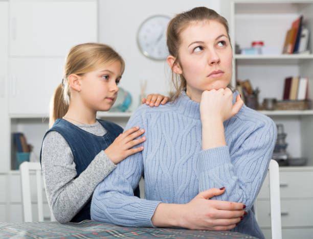 istock Little daughter soothe mom after an quarrel 1170445479