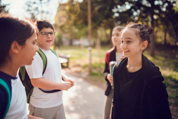 istock Group of classmates having fun at schoolyard 1170462104