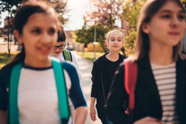istock Girls going to school and smiling 1170462126