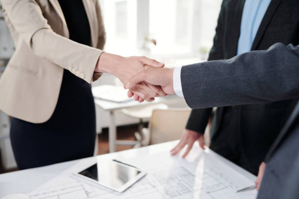 istock Business People Shaking Hands Closeup 1170462360