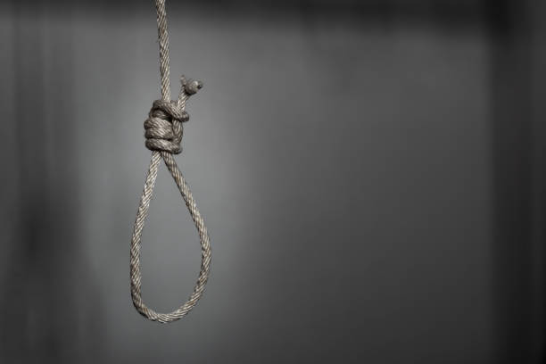 commit suicide concept, Hangman's noose knot in dark room. commit suicide concept, Hangman's noose knot in dark room. silhouette of the hanging noose stock pictures, royalty-free photos & images