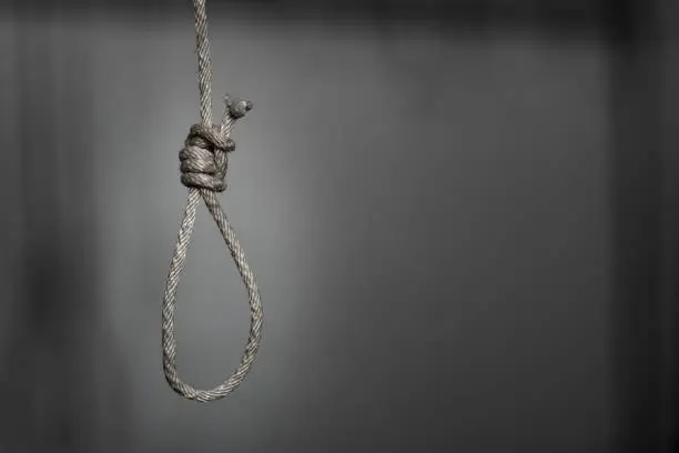 commit suicide concept, Hangman's noose knot in dark room.