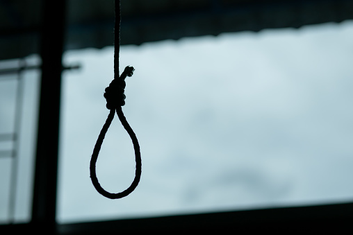 Silhouette of Hangman's noose knot. commit suicide concept.