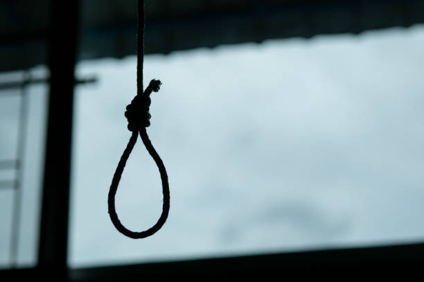 Silhouette of Hangman's noose knot. commit suicide concept. stock photo