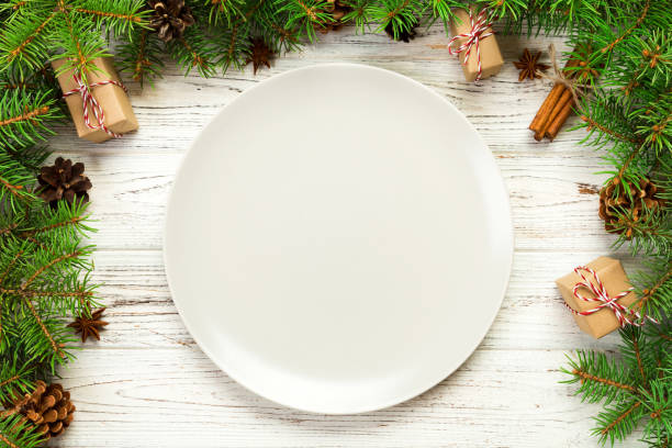 istock top view. Empty plate round ceramic on wooden christmas background. holiday dinner dish concept with new year decor 1170463203