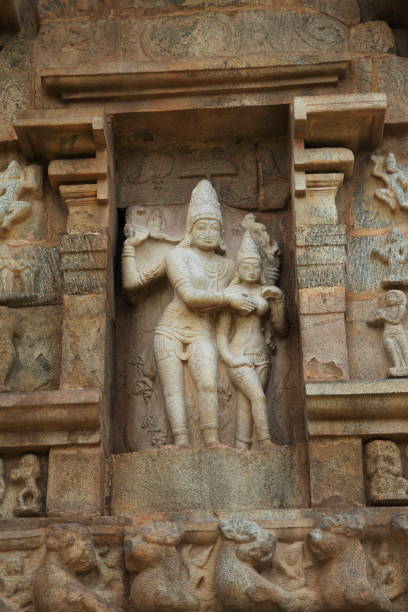 istock Shiva as Gangadhara appeasing Devi, Niches on the western wall, Brihadisvara Temple,  Gangaikondacholapuram, Tamil Nadu, India. 1170464838