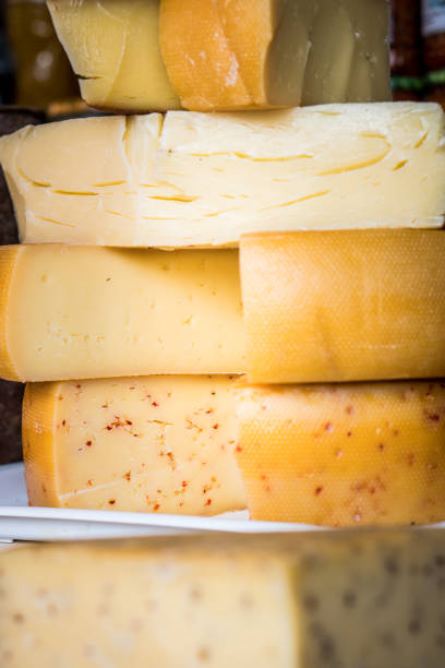 The texture of homemade cottage cheese in close-up. Large and small holes in the cheese