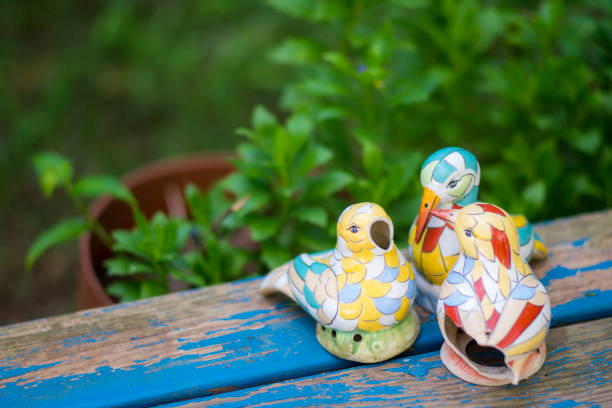 istock Broken colorful porcelain birds in nature. 1170467531
