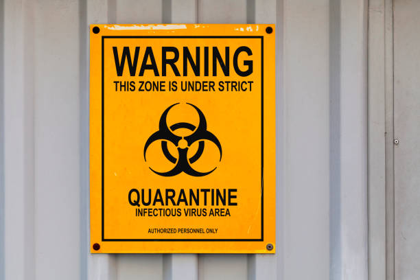 Quarantine sign Warning sign drawn on a black & yellow placard with written in "Warning - This zone is under strict quarantine. Infectious virus area. Authorized personnel only" with ib its middle a Biohazard symbol. emergency shelter photos stock pictures, royalty-free photos & images