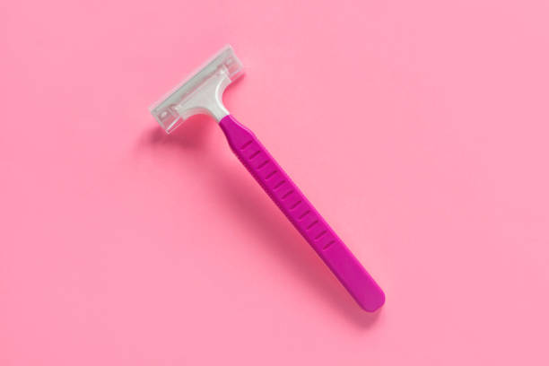istock Disposable shaving machine for women on a pink pastel background, flatley, copy space. 1170469894