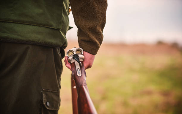 istock Hunter with a rifle in hunting 1170469905