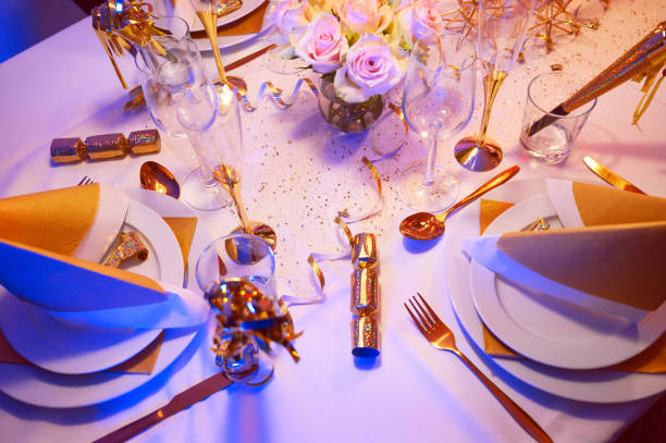 istock Ready for a party with table covered in glitter and gold 1170469951