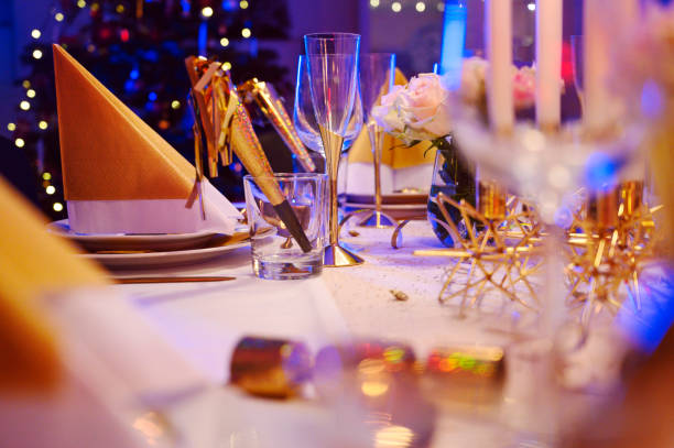 Yellow napkins with white Happy New Year text on blue plate.