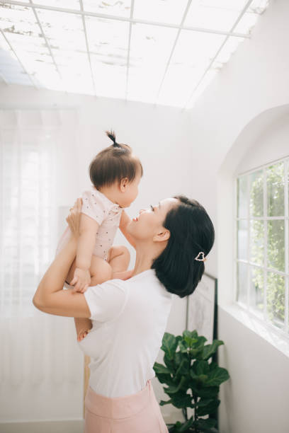 istock young asian mother and baby 1170470262