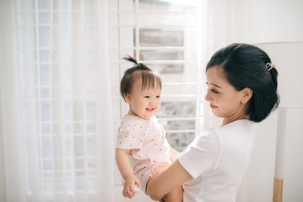 istock asian baby and mom with smile 1170470300