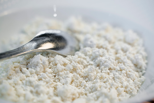 Close-up of white curd cheese in bowl