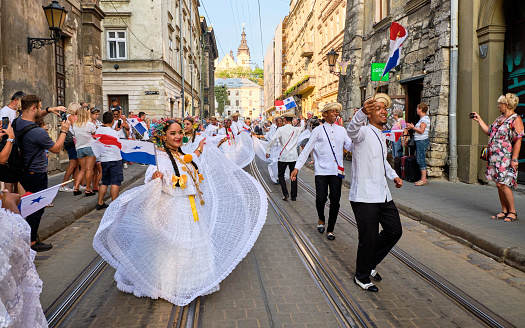 Panama Folklore group dancing down streets during closing the Parade of Etnovyr Festival in street of Lviv. Lviv, Ukraine - August 25, 2019
