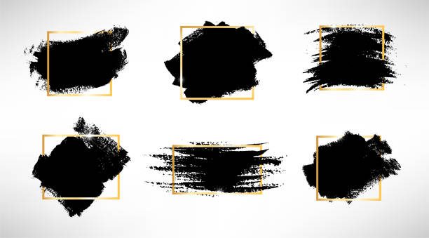 Hand drawn brush spots with golden frame set Hand drawn brush spots with golden frame set. Vector illustration. Black white paint stripes and strokes artistic backgrounds. Grunge texture scribbles frame, box or background for text smudged stock illustrations