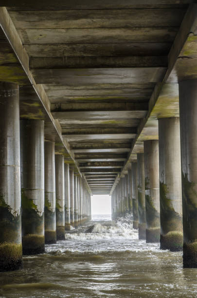 Ocean waves under pier of Atlantic City beach