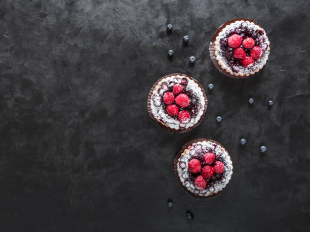 colorful pastry tart sweets on black background