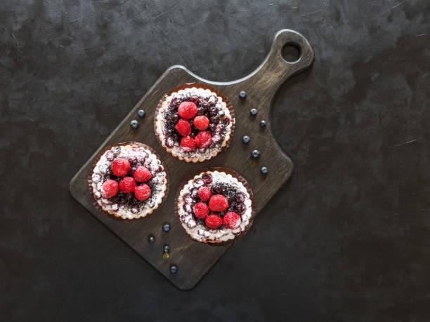 colorful pastry tart sweets on black background