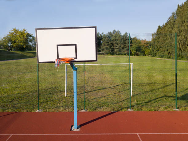 istock Empty field with basketball stand 1170477943
