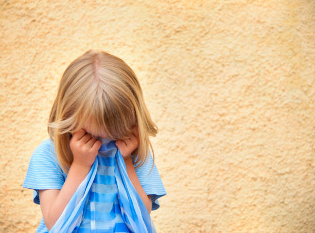 istock Little Girl Covering her Face 1170478536