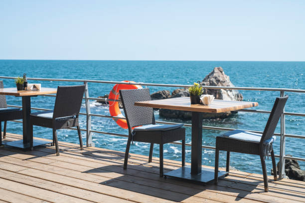 istock Table and chairs on the veranda by the sea. 1170482085