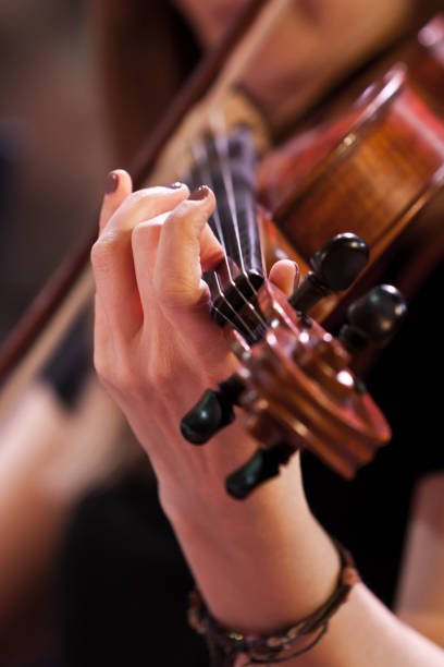 istock Hand girl playing the violin closeup 1170482265