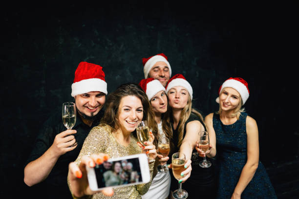 istock Happy friends having fun celebrating Christmas 1170482378