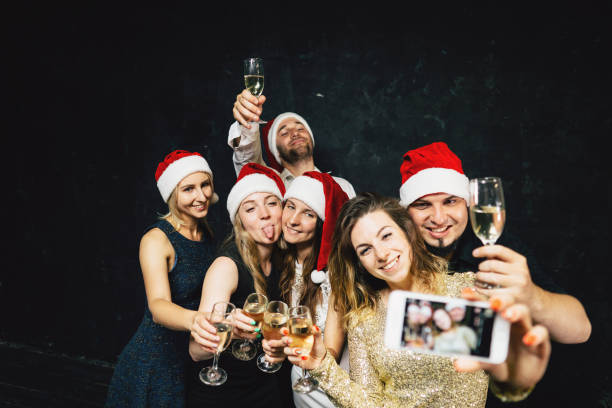 istock Happy friends having fun celebrating Christmas 1170482380