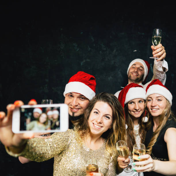istock Happy friends having fun celebrating Christmas 1170482388