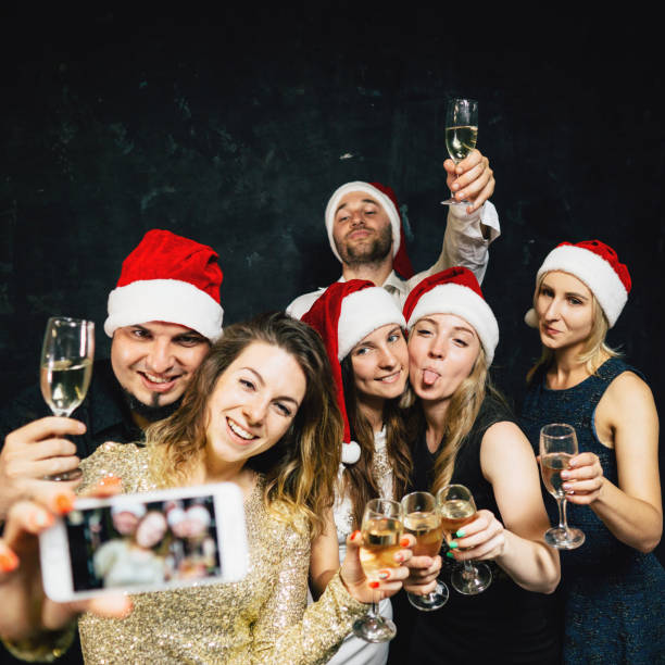 istock Happy friends having fun celebrating Christmas 1170482394