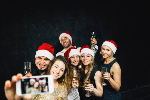istock Happy friends having fun celebrating Christmas 1170482401