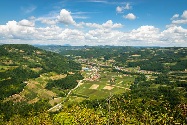 istock View over green valley from mountain peak. 1170483193