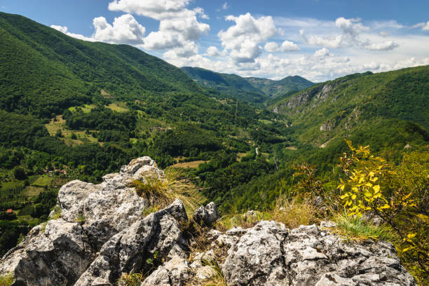 istock View over green valley from mountain peak. 1170483269