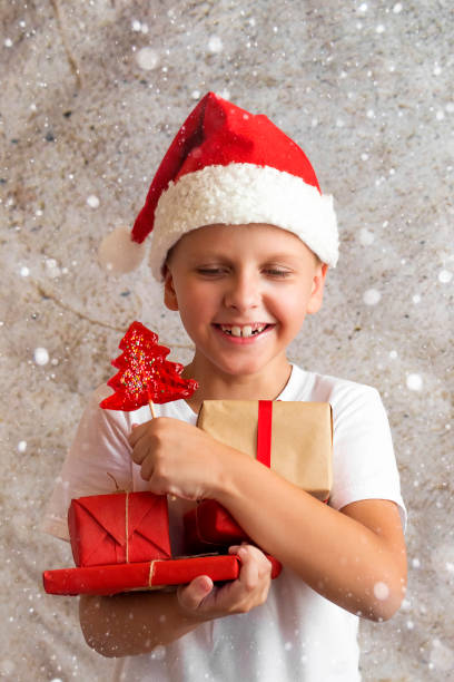 istock an eight-year-old boy in a Christmas hat 1170483769