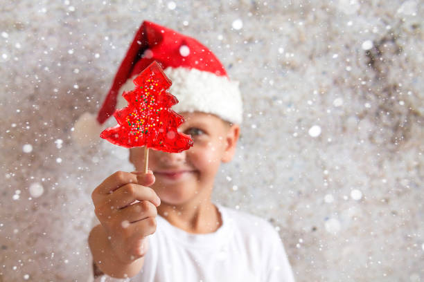 istock an eight-year-old boy in a Christmas hat 1170484467